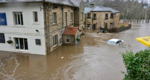 Rivière en crue sous un pont, risque couvert par le plan intercommunal de sauvegarde